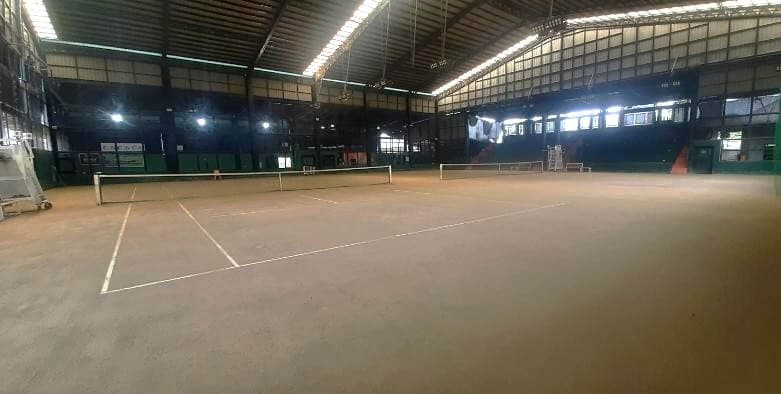 Tennis court with players at ZENtro Sports Complex